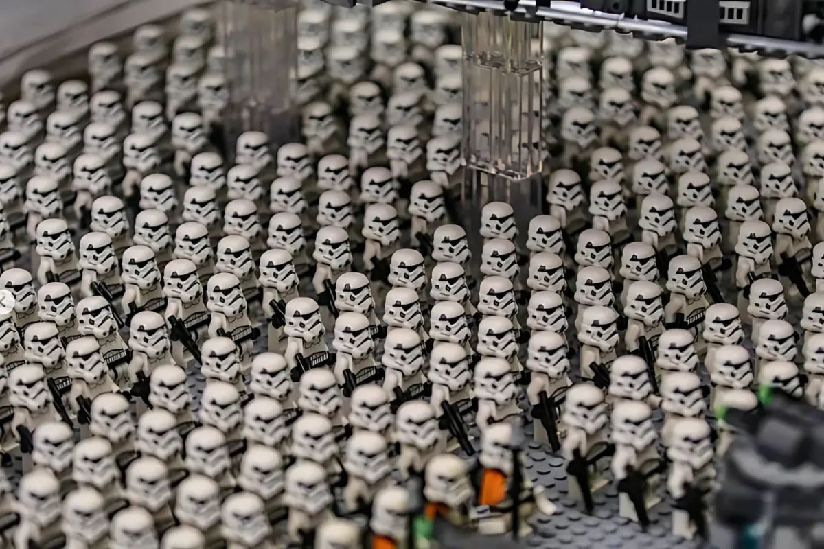 A massive formation of LEGO Star Wars Stormtrooper minifigures standing in formation, armed with blasters, recreating an imposing Imperial army display.