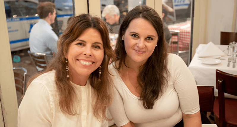 portrait of two women in a restaurant