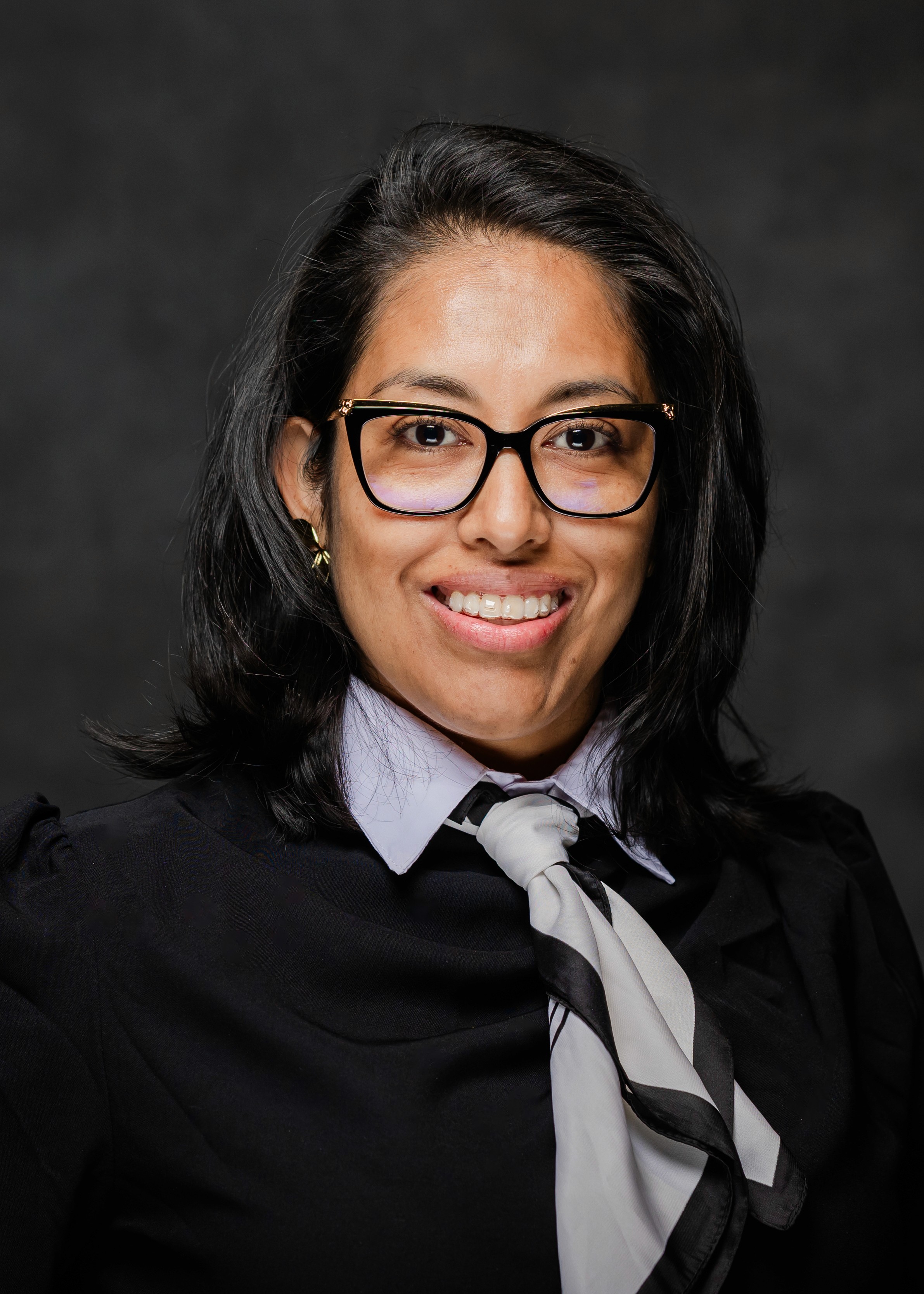 a black and silver object with a black background