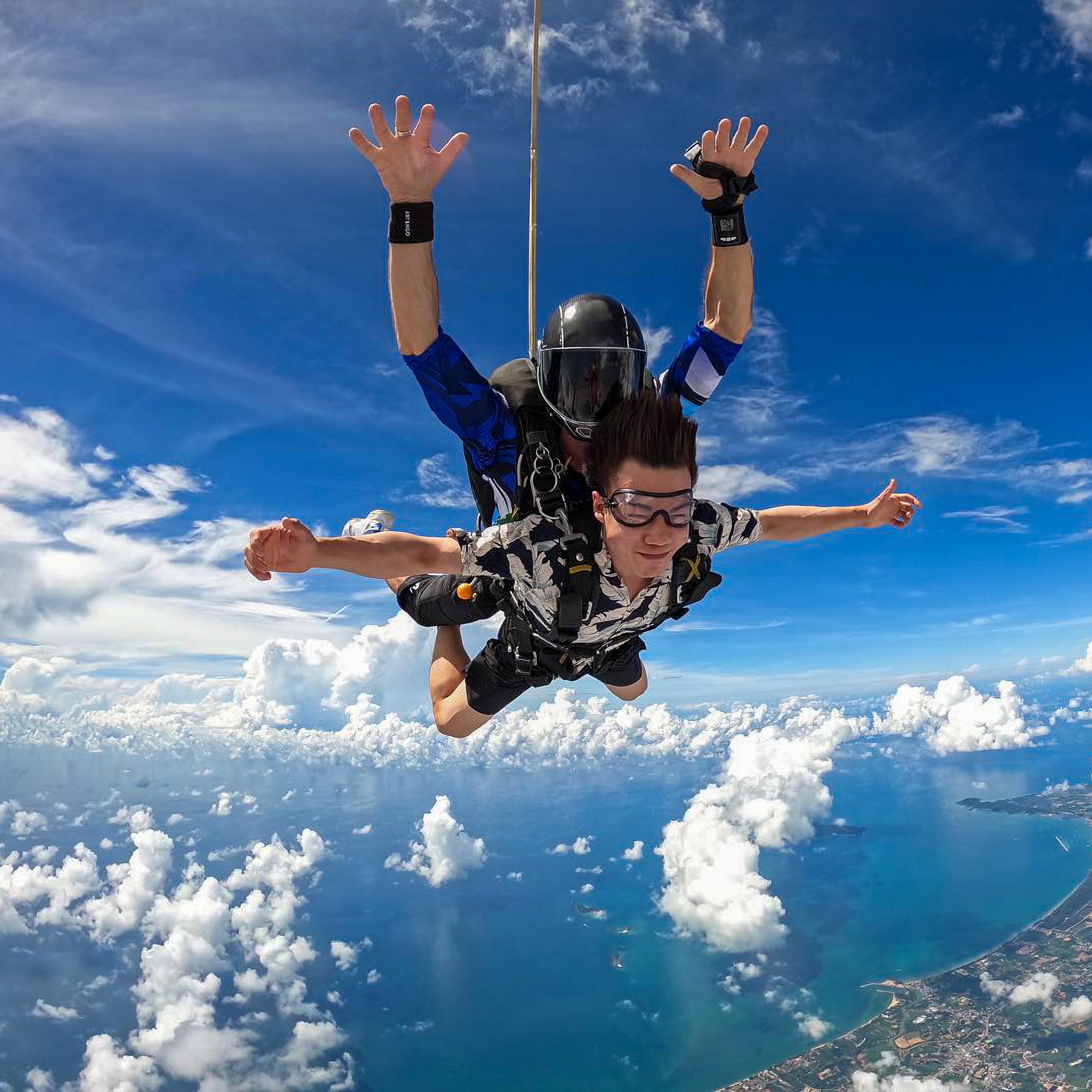 Tandem skydiver with instructor in freefall