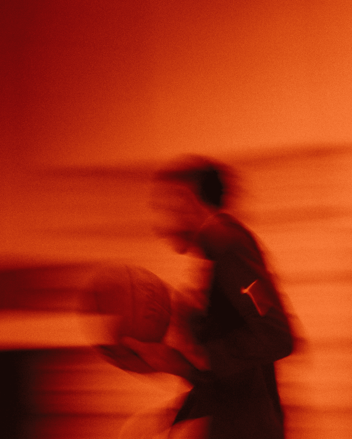 Man running fast at night with motion blur