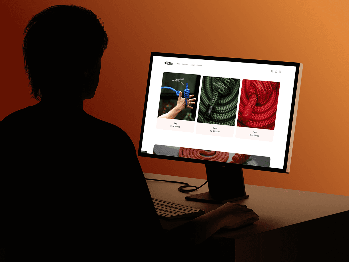 Person browsing Subtle’s website on a desktop setup