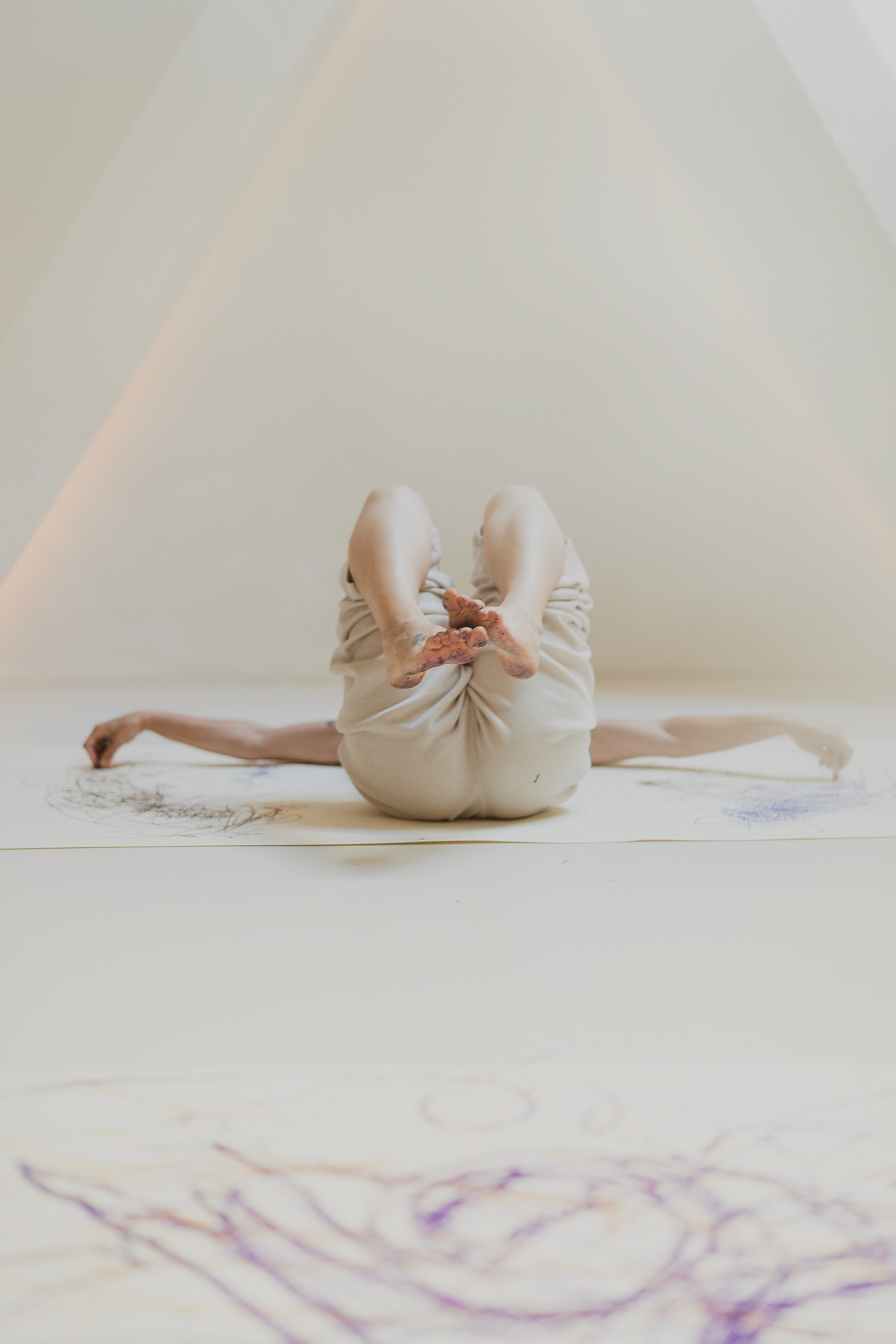 A fast black sports car races down the highway.
