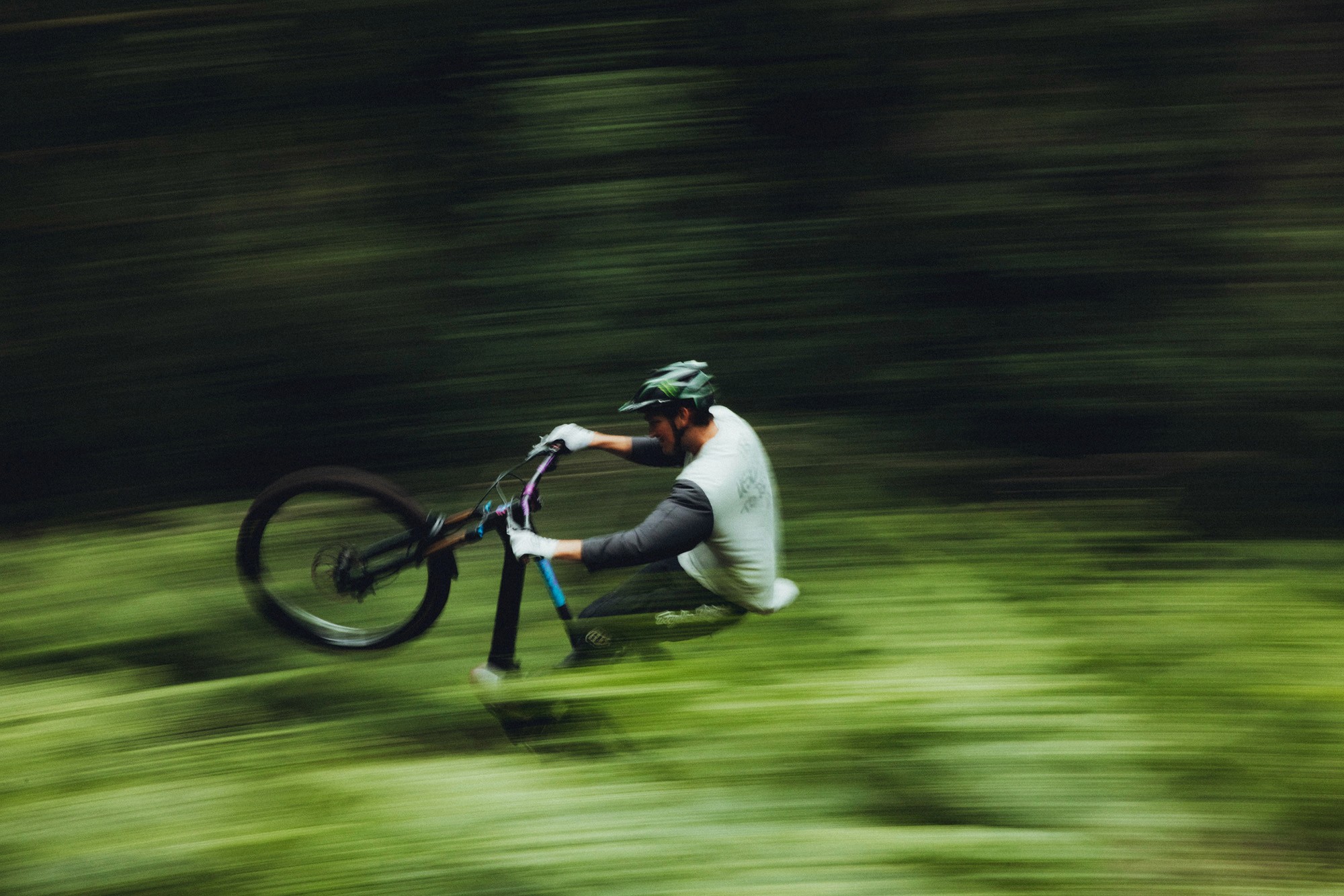 Mountain biker riding through forest