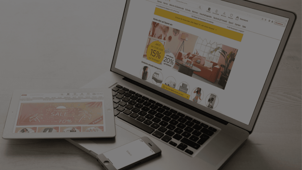 Laptop, tablet and smartphone displaying BAUR and OTTO online shops on a desk.