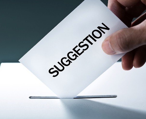 Photo of a suggestion card being posted into a slot