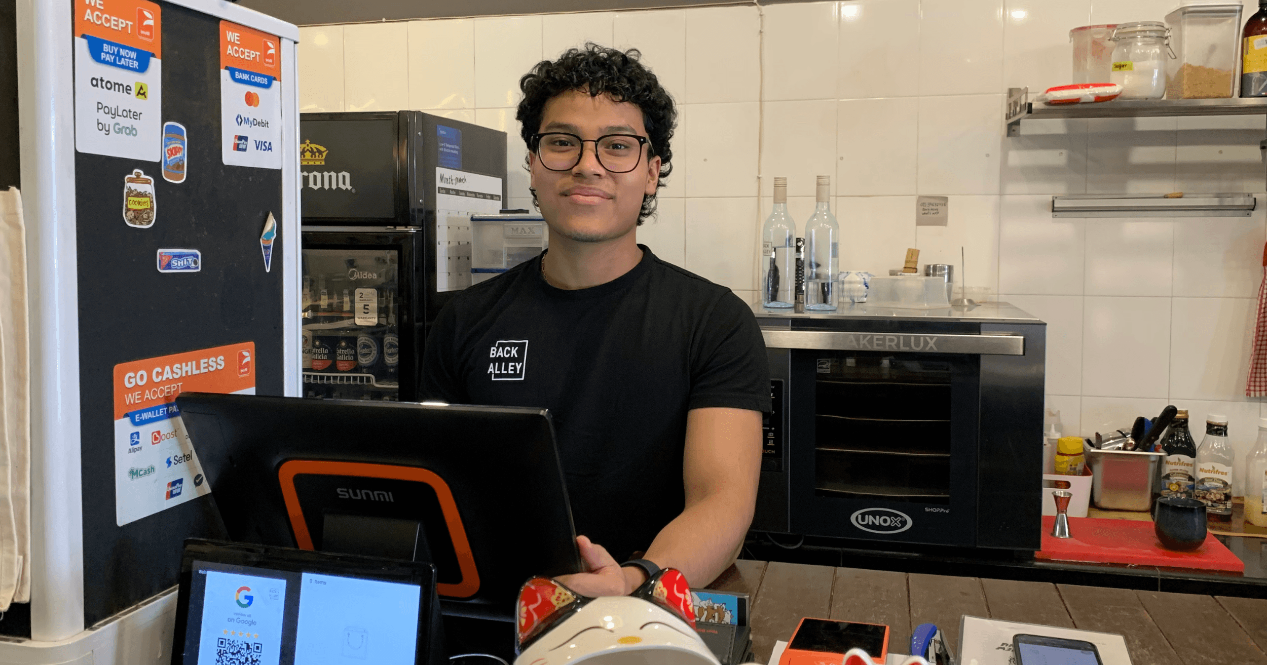 A Back Alley Pasta Bar staff with the StoreHub POS