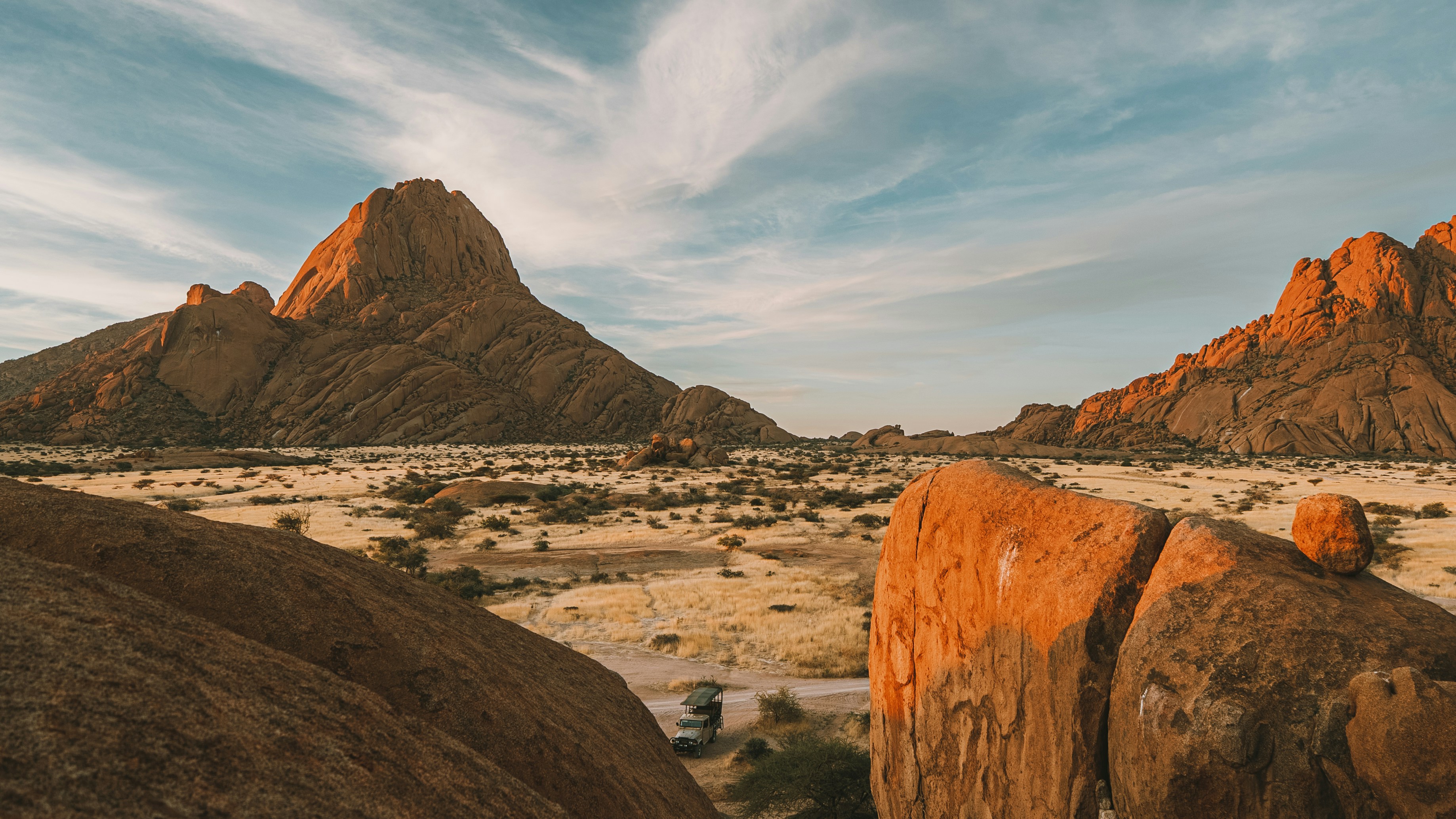 Desert landscape with large rock formations at sunset