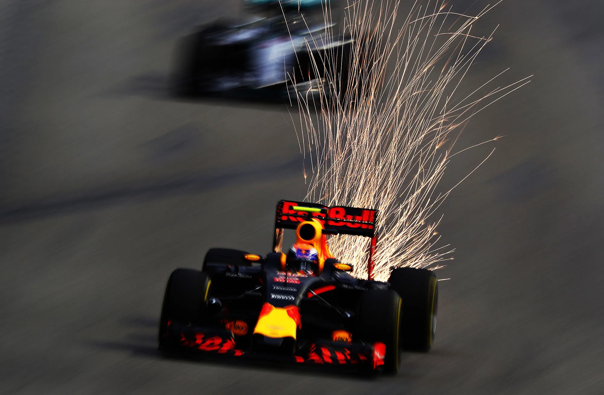 why do f1 cars spark, f1 car sparks explained, formula 1 sparks under car, why f1 cars spark at night, f1 skid blocks sparks, titanium skid blocks f1, f1 ground effect sparks, f1 plank and skid blocks, f1 ride height sparks, do f1 sparks mean damage, are f1 sparks dangerous, f1 night race sparks, singapore f1 sparks, f1 bottoming out sparks, fia skid block rules, how f1 aerodynamics work, f1 ground effect explained, modern f1 cars sparks, 2022 f1 ground effect sparks, formula 1 technical explained