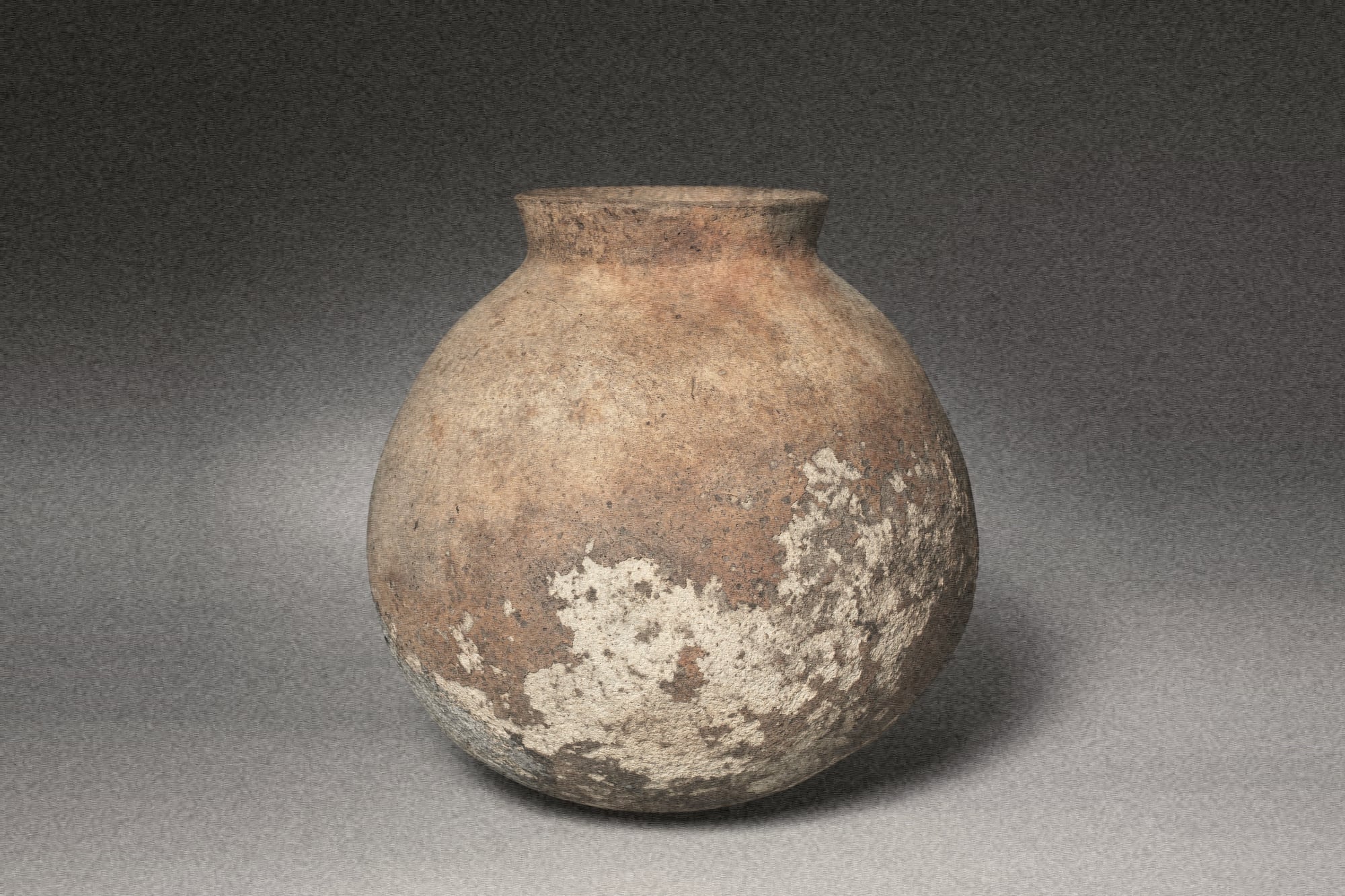 round earthenware storage jar with pale crusted patches