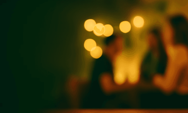 Close-up of a green palm leaf with intricate veining and texture, showcasing rich shades of green.