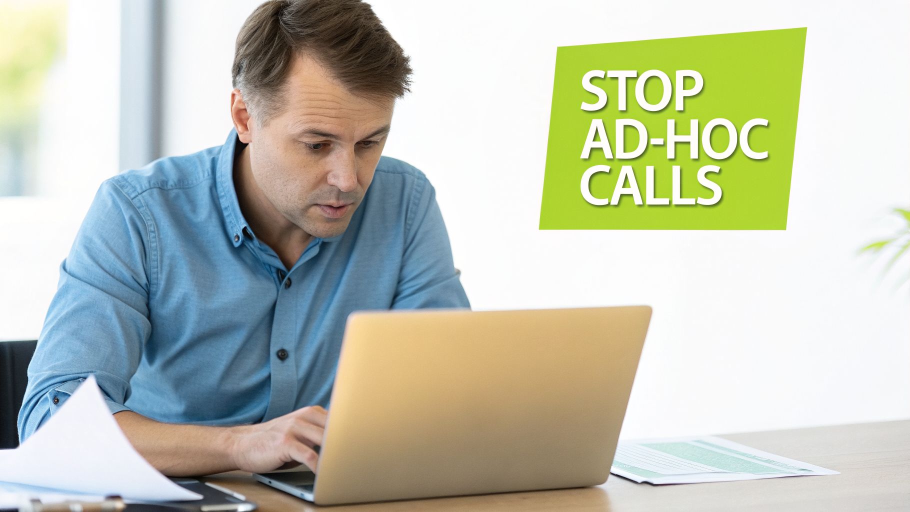 A professional man intently uses a laptop at a desk, with a green 'STOP AD-HOC CALLS' banner beside him.