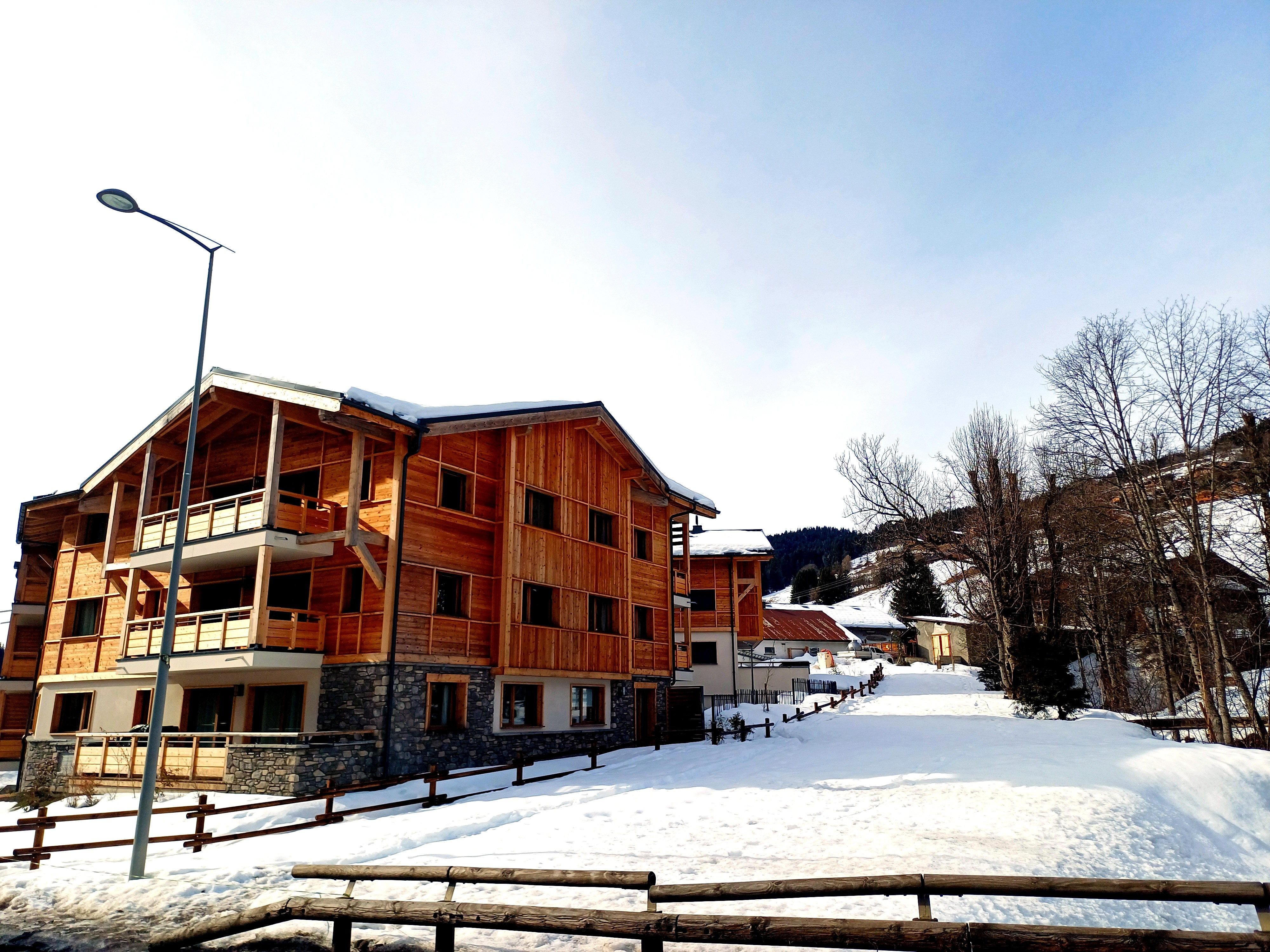 Snow-covered exterior of the MyAlpineWeek residence in Les Gets