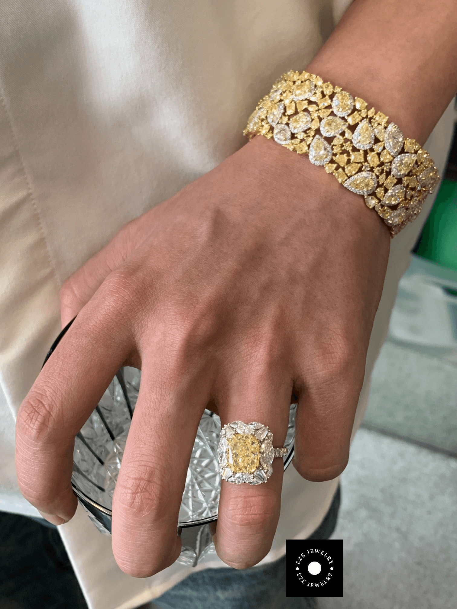 Natural fancy yellow diamond ring and matching diamond bracelet in 18K gold, showcasing vibrant color and brilliance.