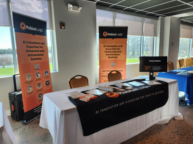 A table with a white tablecloth and a black and orange bannerAI-generated content may be incorrect., Picture