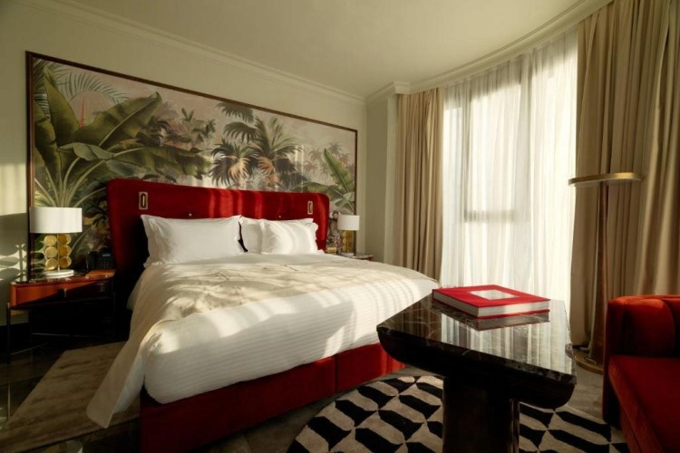 sunloungers fronting buildings near mountain