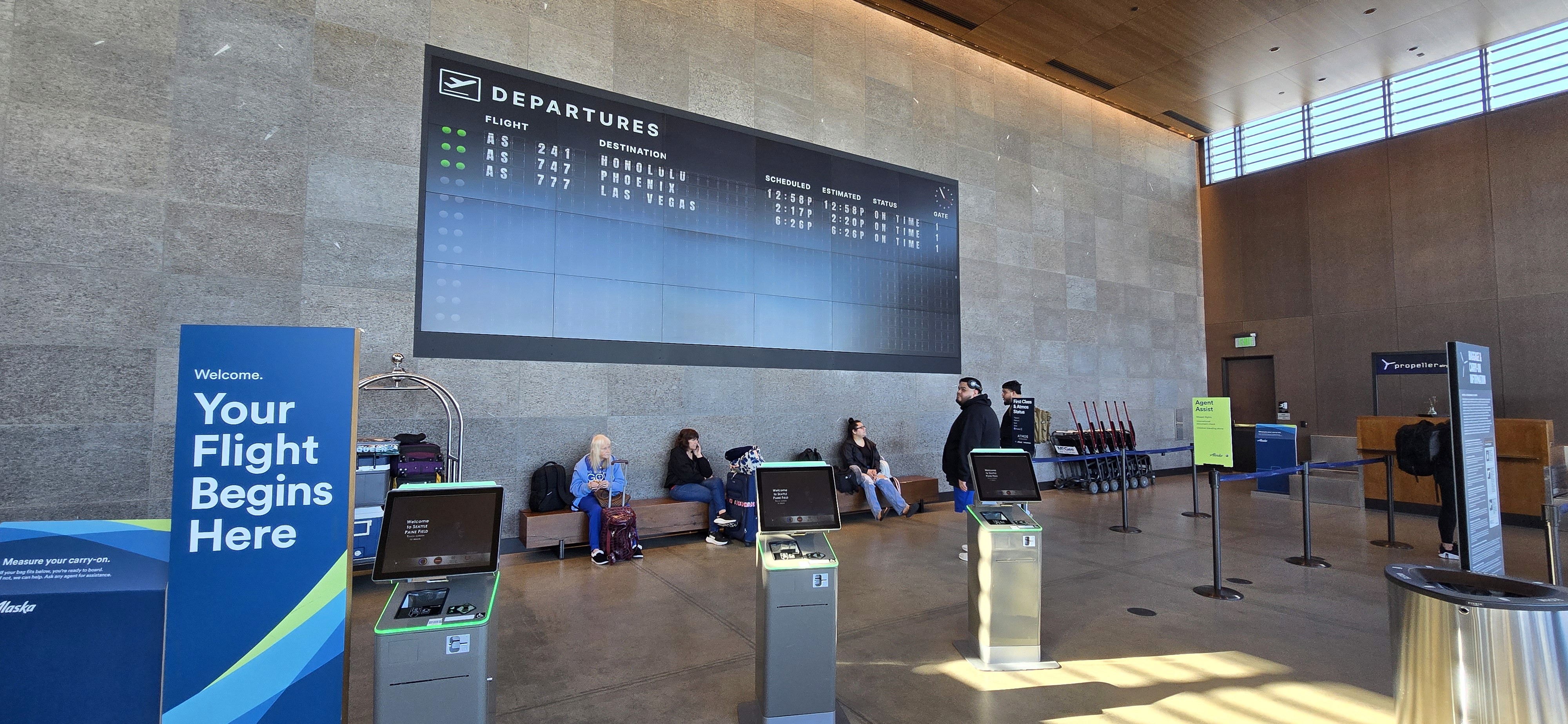 A photo of the FIDs screen at Paine Field Airport
