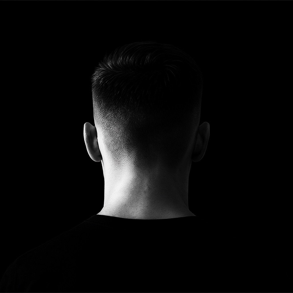 a blurry photo of a person standing in front of a wall