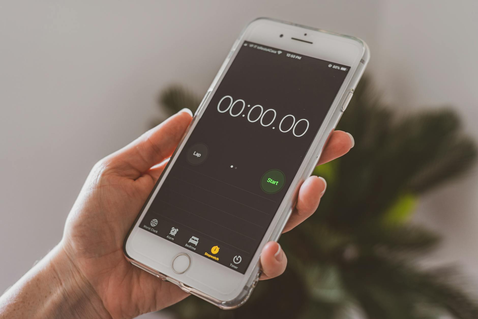 A coach records performance data on a tablet while a student completes a shuttle run agility test.
