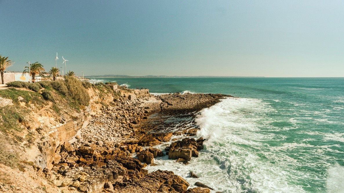 blue and white painted houses on the cliff
