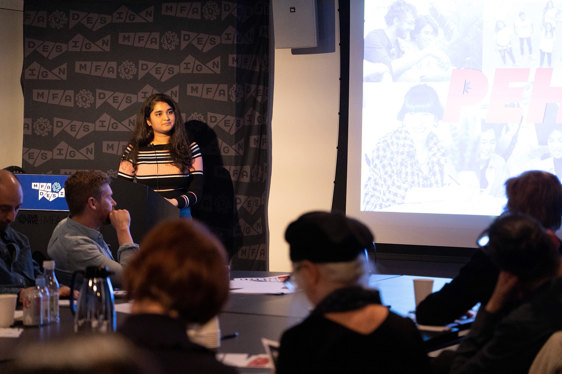 a student giving a presentation from a podium
