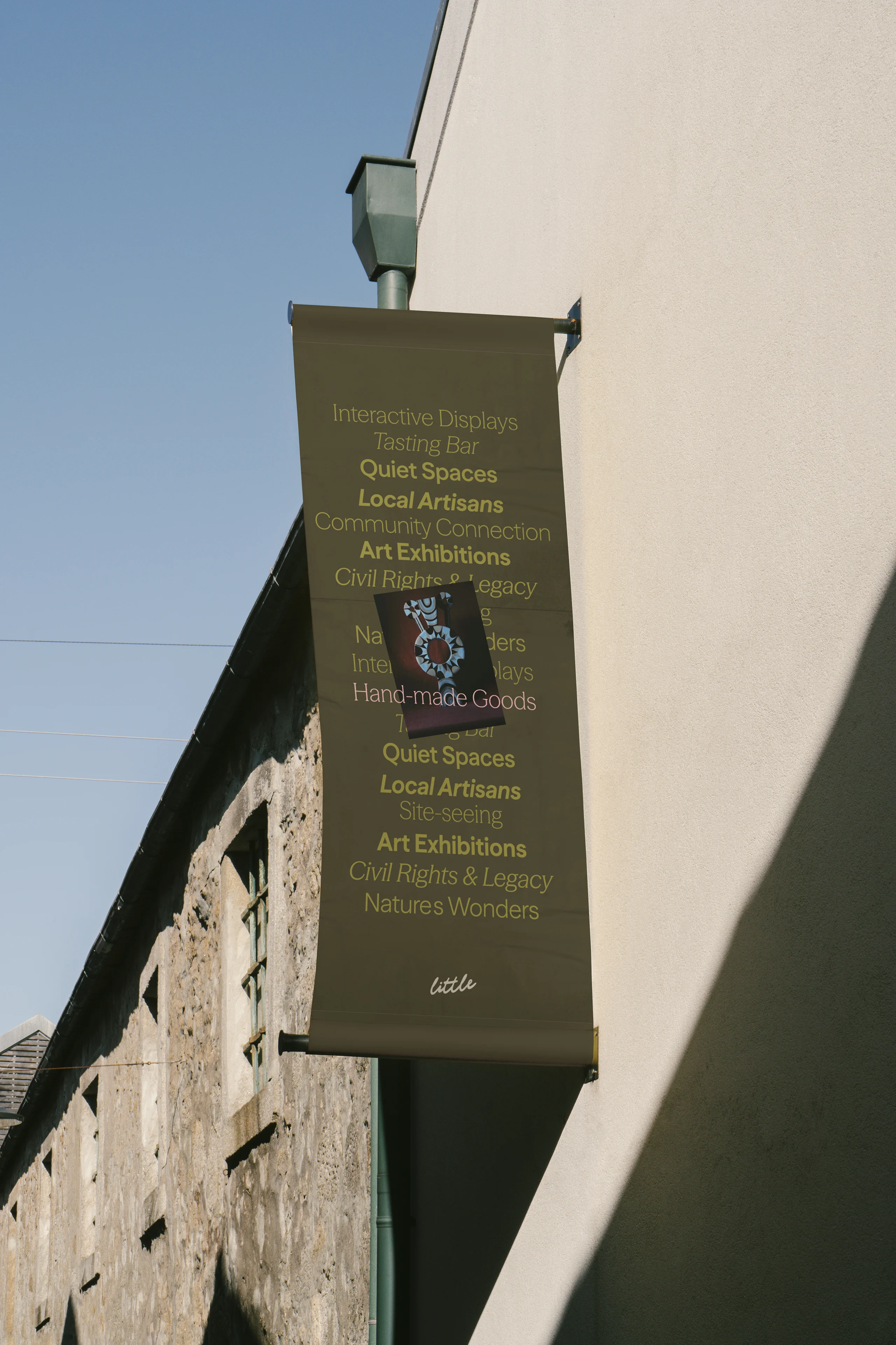 Streetside billboard with flyposters of the Batch.Works brand and illustrations