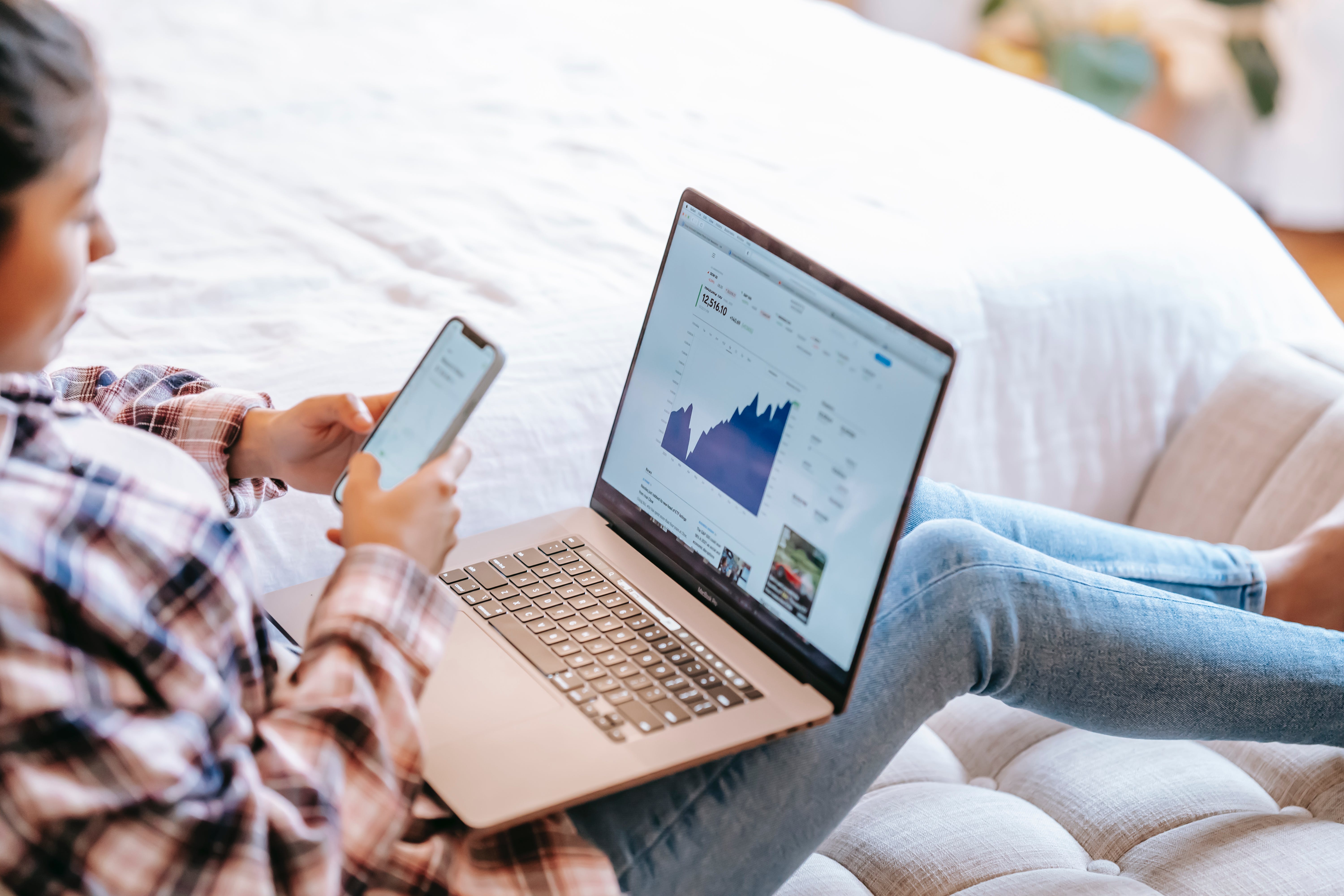 Woman observing the peak of mortgage rate using laptop