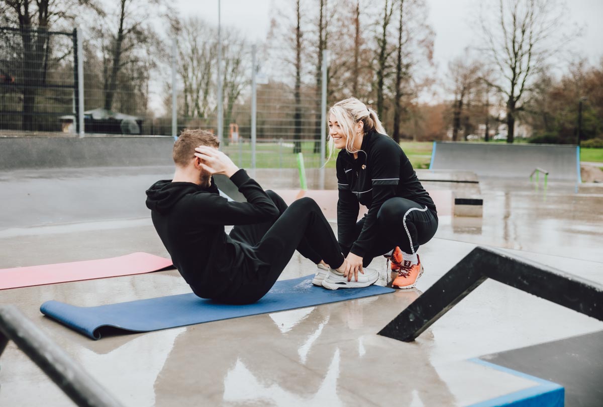 Client working triceps and back muscles