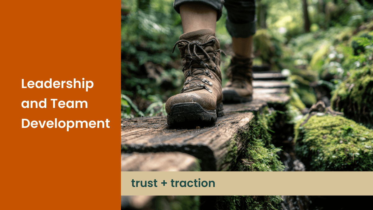 Adventure picture of hiking in the forest that says Leadership and Team Development with the capition trust plus traction