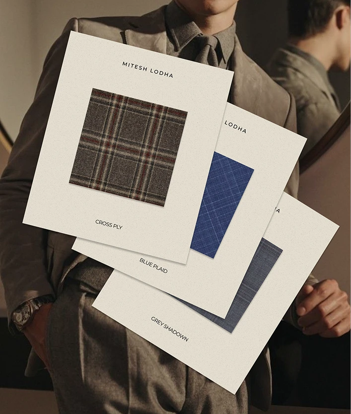 Three cream swatch cards fanned out in front of a man in a grey suit: "Cross Ply", "Blue Plaid" and "Grey Shadow".