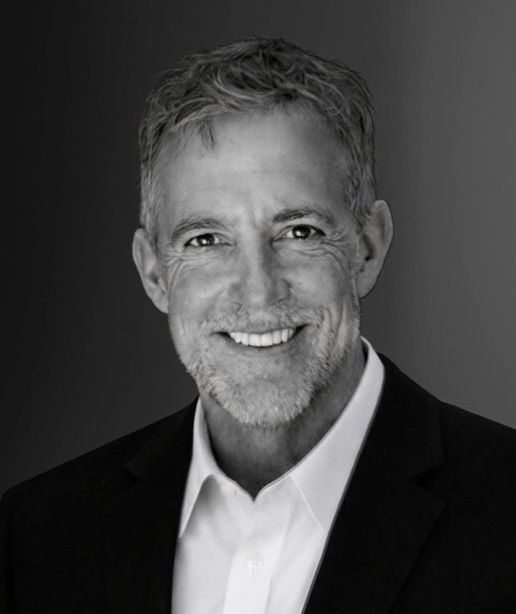 Rustic cabin in a golden field at sunset