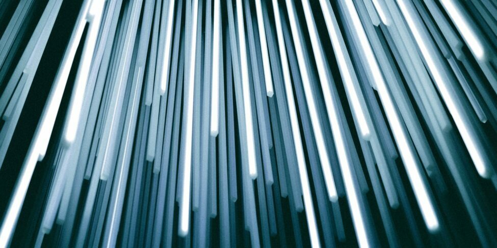 Abstract image of dynamic light streaks, representing the speed and innovation of conversational technology in the future of data-driven business