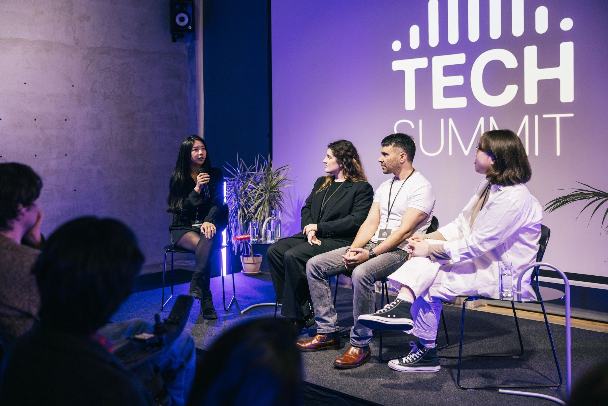 a black and white living room with a large tv