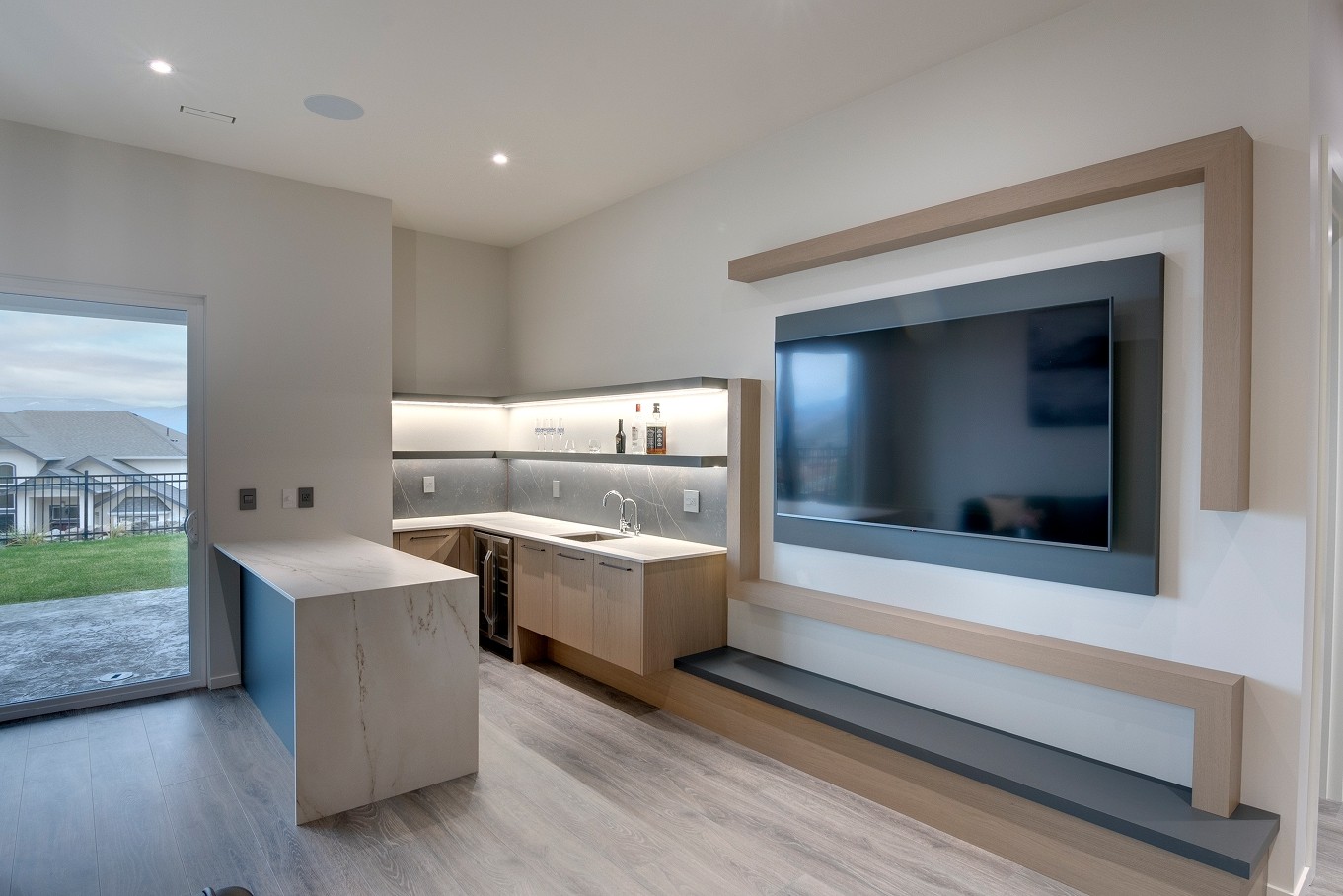 Minimalist open-concept living room with built-in shelving