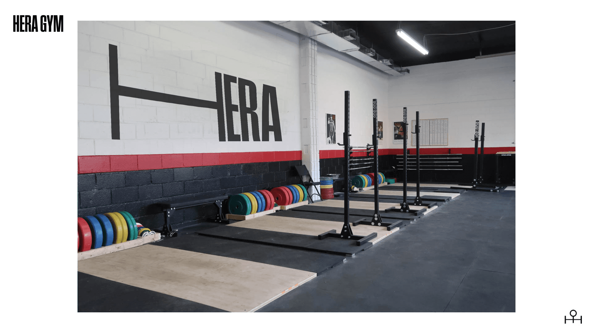 A laptop screen displays a fitness website featuring a woman lifting a red weight on a barbell, with the text "30 DAYS TO GET IN THE WEIGHT ROOM" and a "GET STARTED" button in a gym setting.