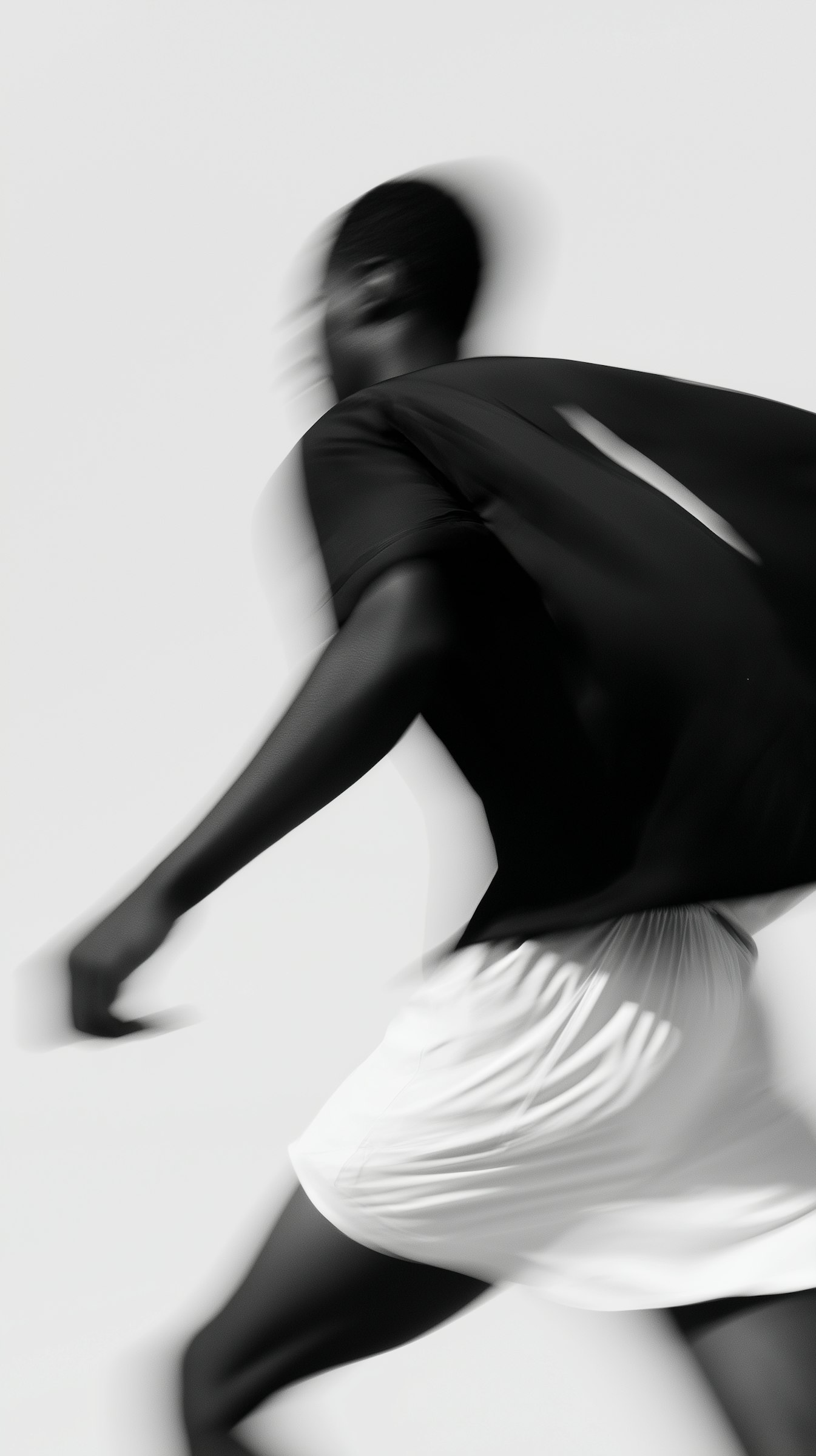 Black and white artistic photograph of a woman’s leg in motion, symbolizing form, movement, and abstraction in the Frysta Framer Template by Orbitx Supply.