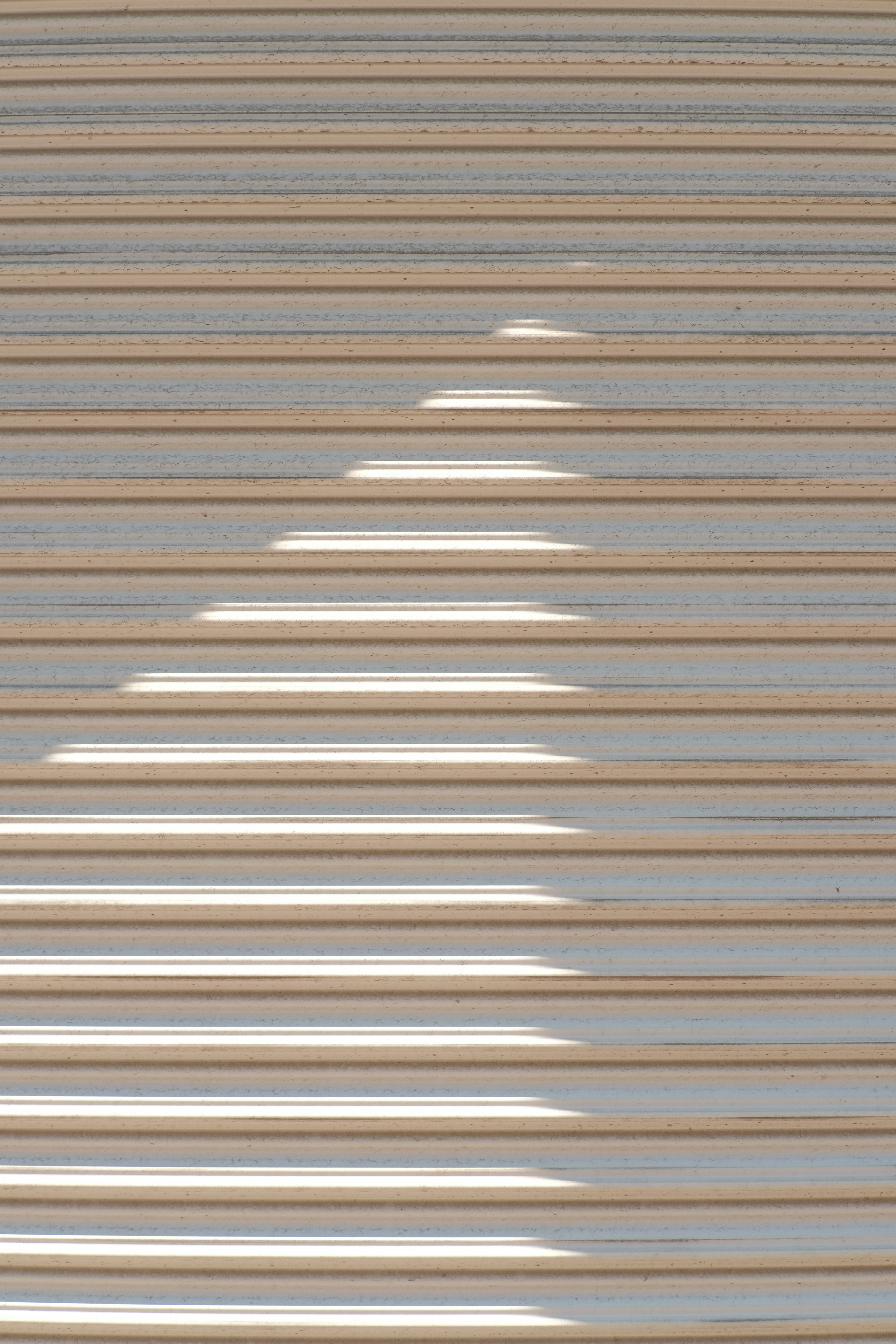 a shadow of a person standing in front of a window