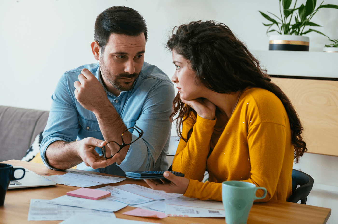 Young couple planning a new purchase sitting together