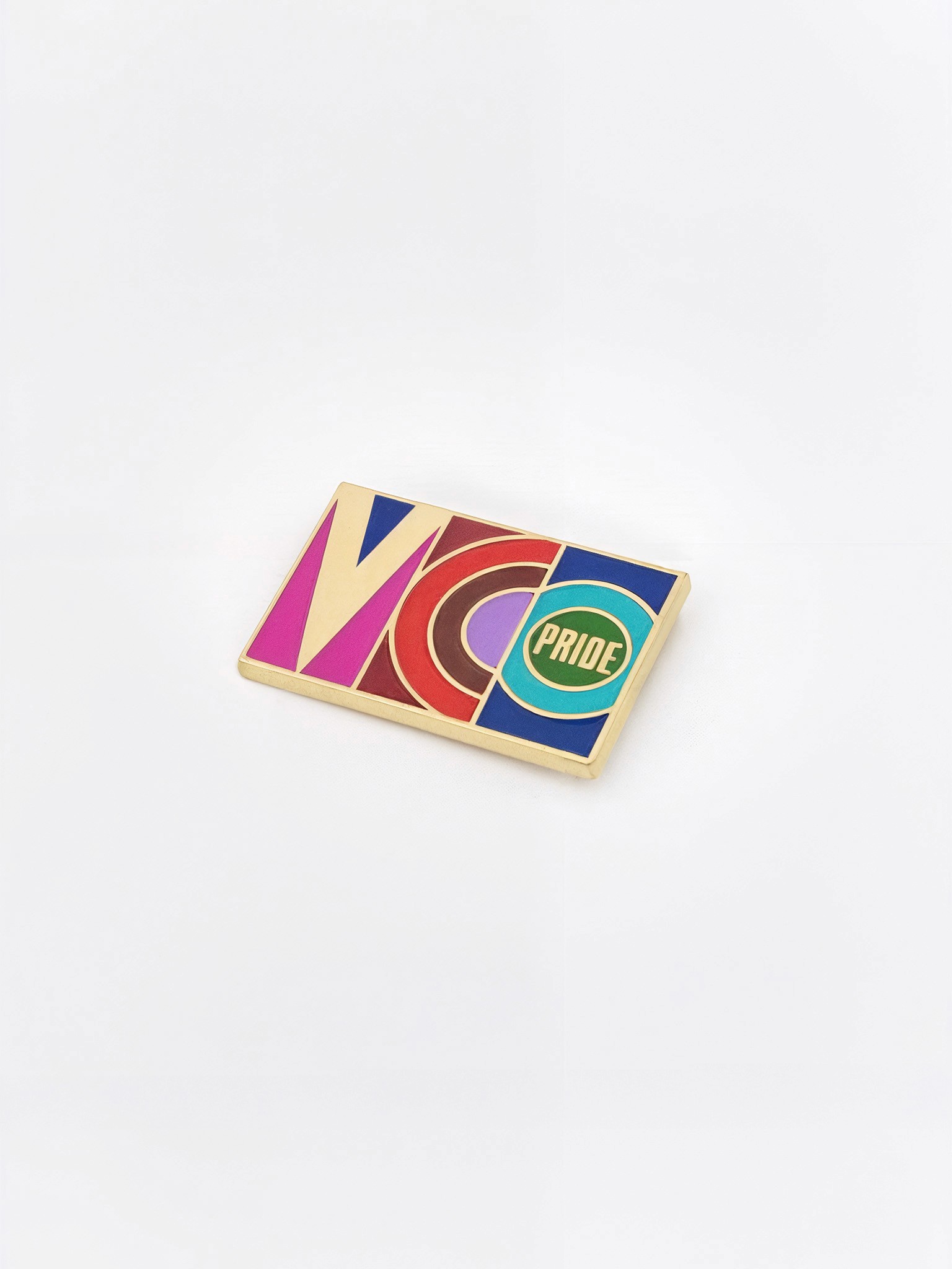 A rectangular enamel pin featuring the colorful VCO Pride logo, created as a fundraising item.