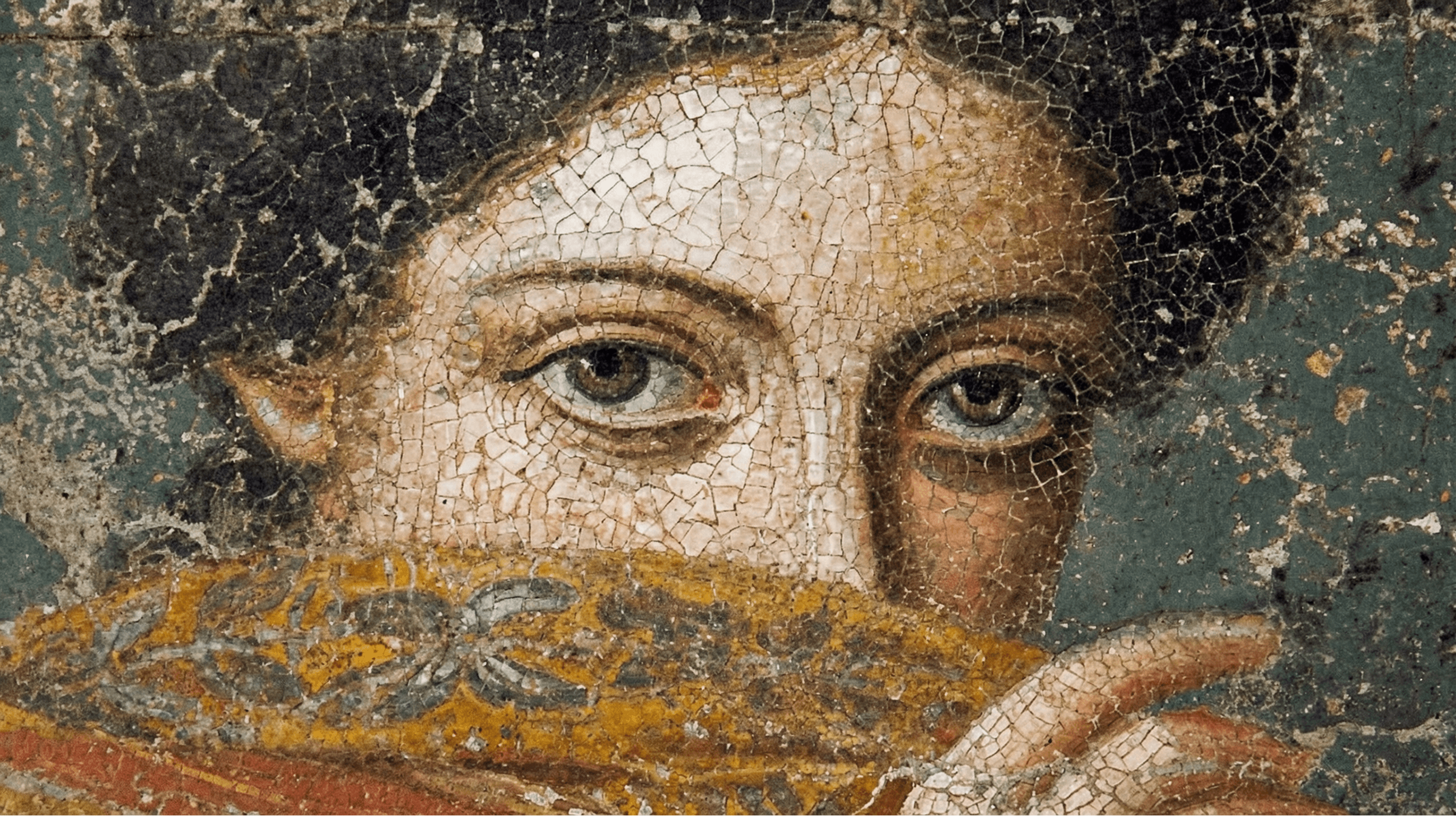 Weathered Hellenistic mosaic portrait, eyes framed by dark hair and a golden veil.
