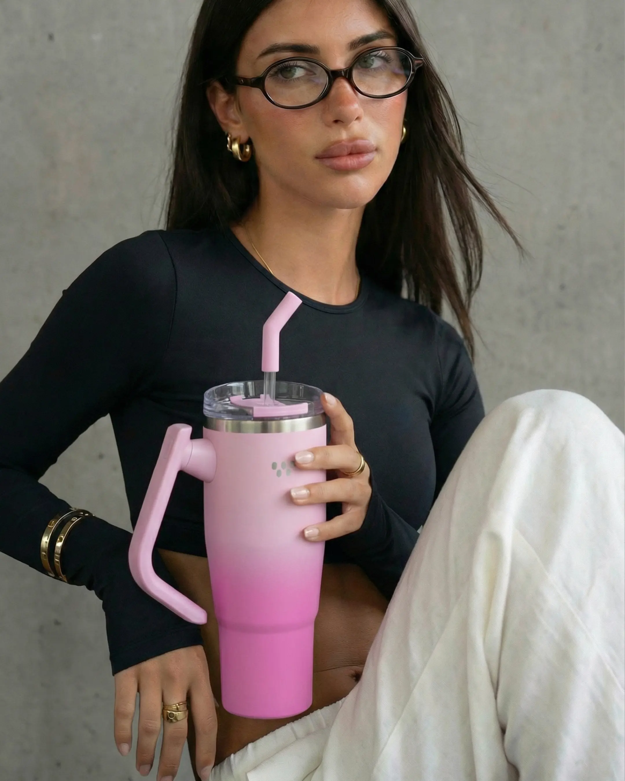 Man in patterned shorts jumps into a lake