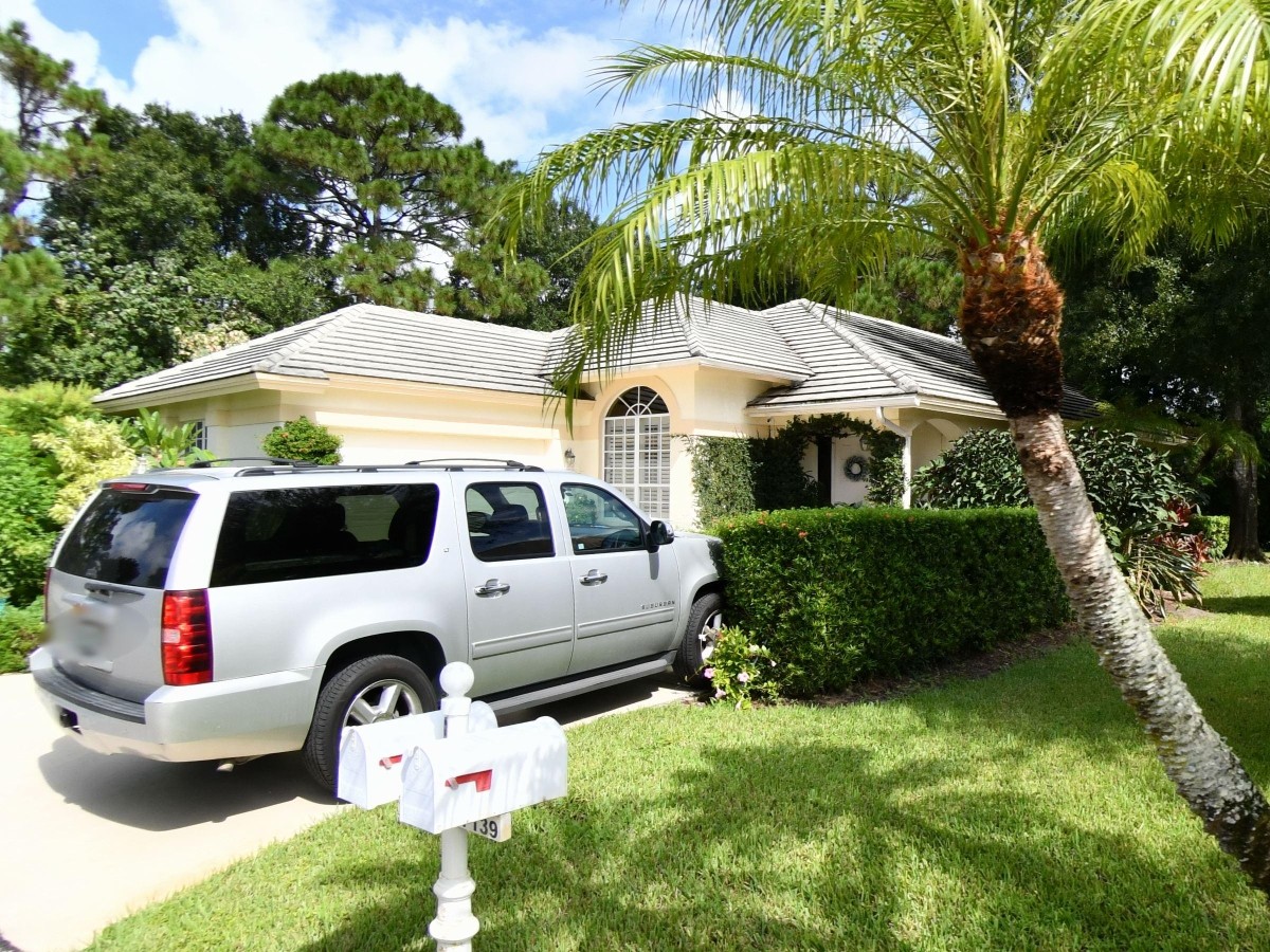1995 New Roof Construction in Hawks View, PGA Village, Port St Lucie with Entegra Flat Broomswept Tile in Natural Gray