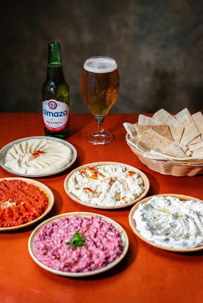 Restaurant exterior with black facade and welcoming atmosphere.