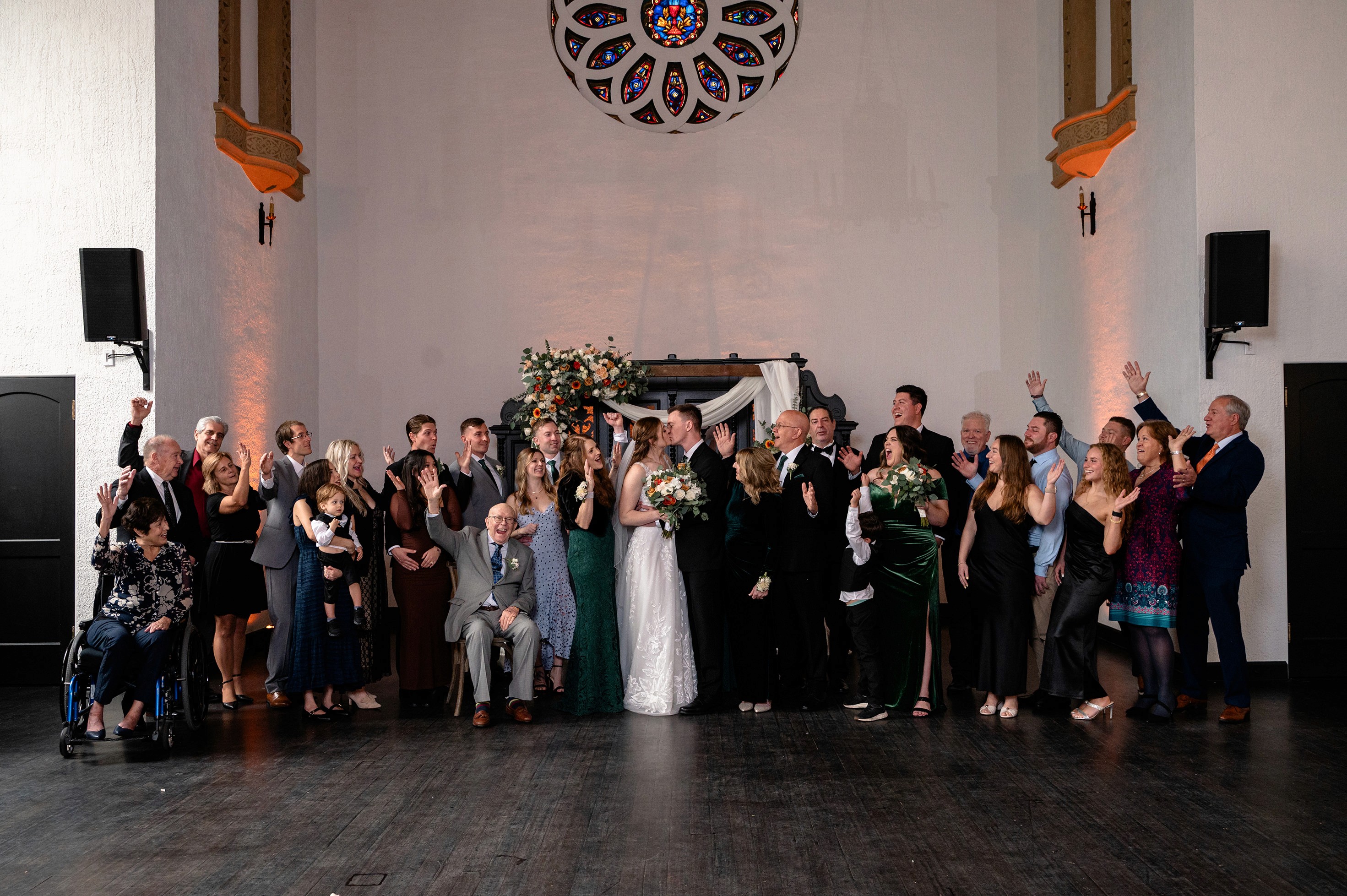 Flat lay wedding details with bouquet, rings, and sparkling bridal heels