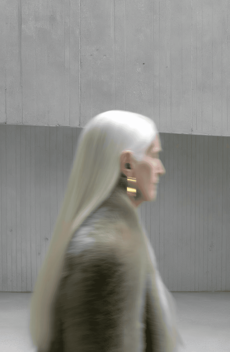 lady walking past wall