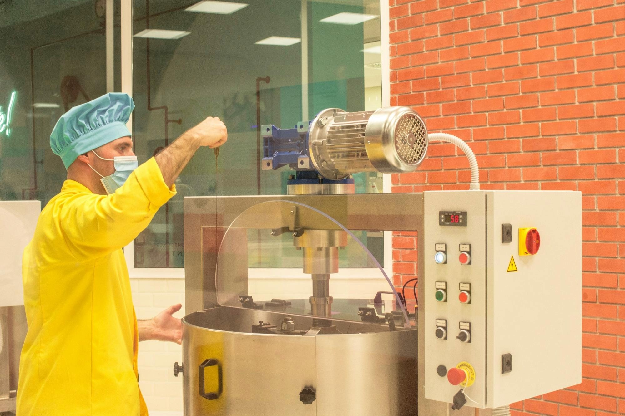 Machines in a gummy vitamin manufacturing plant, blending and molding the supplements