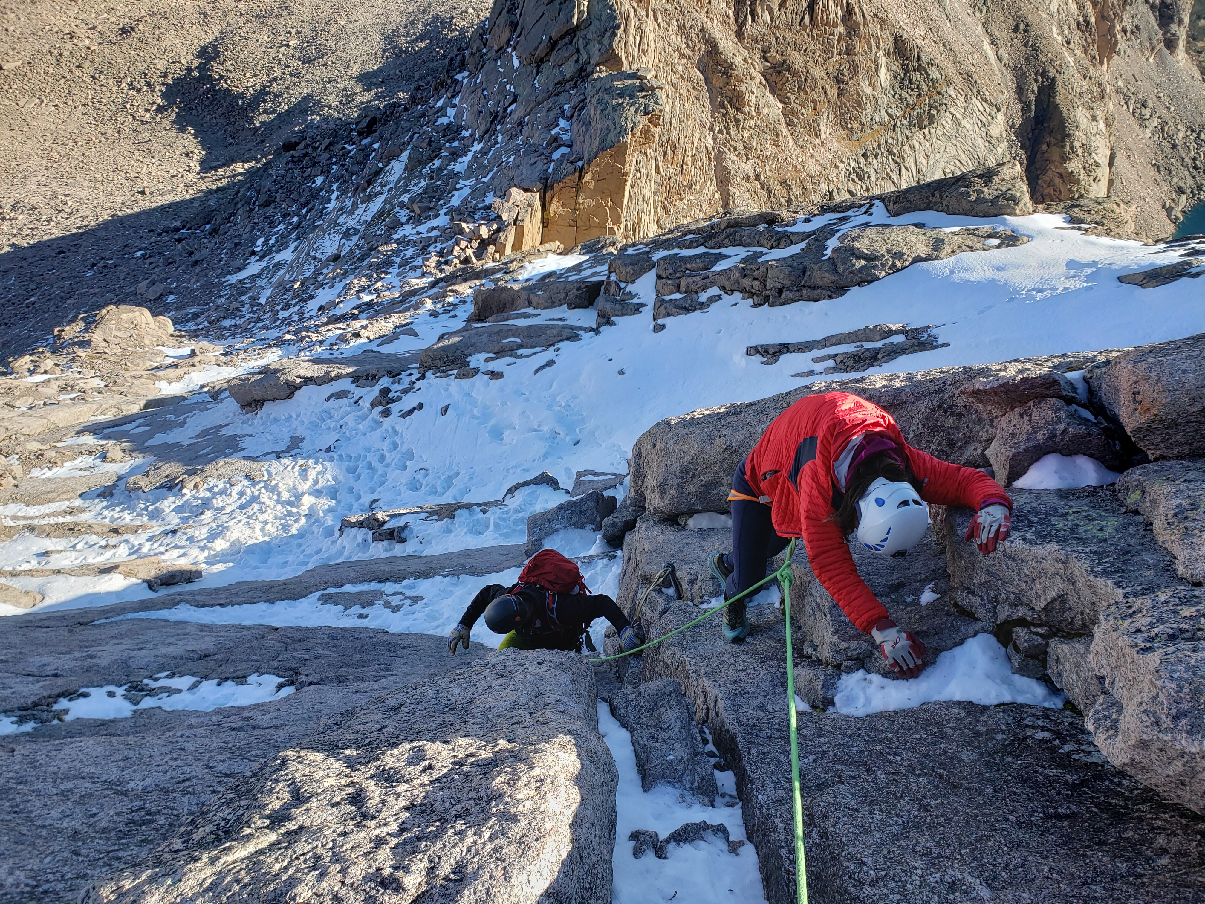 Climbers look for their feet in snowy conditions on the Cables Route on Long's Peak