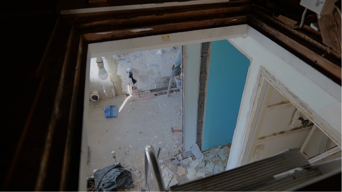 View from stairwell showing internal layout reconfiguration during house refurbishment project
