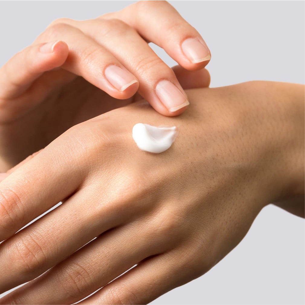 I.D. Swiss Botanicals skincare cream texture applied on hand showcasing product consistency and sensorial experience