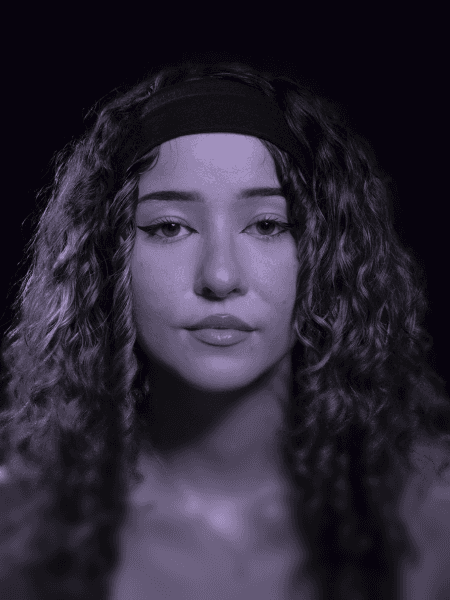 Professional portrait of person on a modern purple gradient background, business headshot for digital branding and team profile.